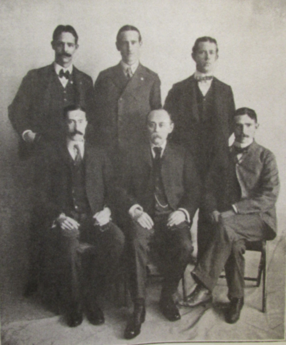 Dorrler in 1902, seated in center, to his left Tewes, to his right, P. J. O’Hare.